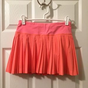 Lululemon neon coral Pleat To The Street skort